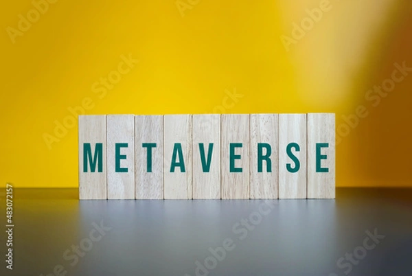 Fototapeta Metaverse, Wood Blocks on Yellow Background.