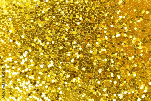 Fototapeta Yellow confetti sparkle. The texture glitters with golden sequins. Lots of scattered shiny circles.