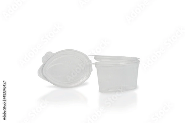 Fototapeta Medium plastic sauce container with open lid on a white background
