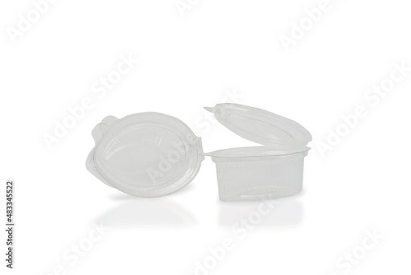 Fototapeta Small plastic sauce container with open lid on a white background