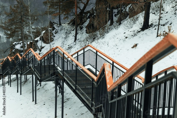 Fototapeta View of the stairs on the tourist route to the mountain.