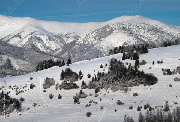 Obraz beautiful snow covered mountains with skiers