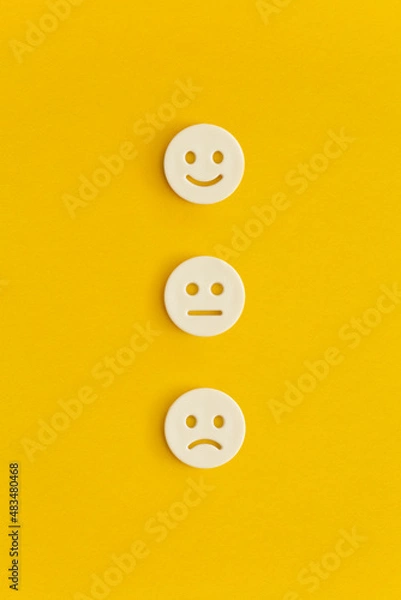 Fototapeta Emoticon smile on a yellow background. Customer feedback.