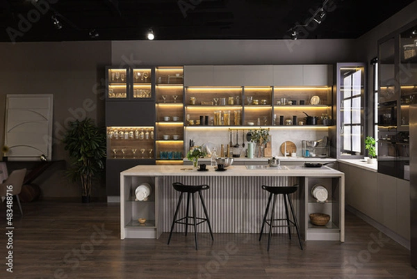 Obraz stylish luxury kitchen interior in an ultra-modern spacious apartment in dark colors with super cool led lighting and an island for cooking