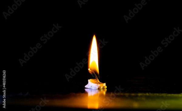 Obraz Candle light with the black background