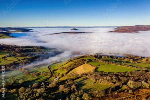 Fototapeta Aerial view of low level fog and cloud in a valley in the rural Brecon Beacons, Wales