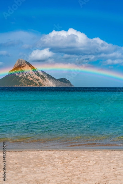 Fototapeta Tavolara Island, scenic view of island and full rainbow in a unique moment