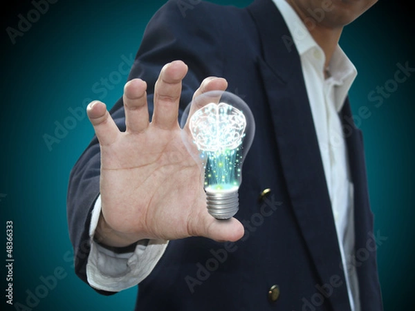 Obraz Hand holding lightbulb