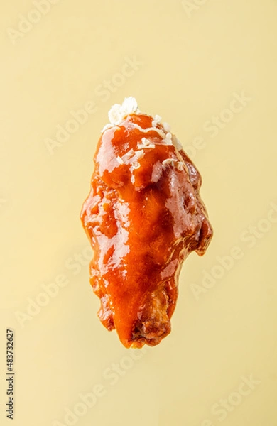 Obraz buffalo wing in sauce, on a bright background, BBQ wing