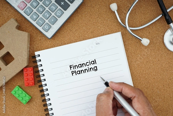 Fototapeta financial planning wording on note book a few item related such as calculator, stethoscope, and education item