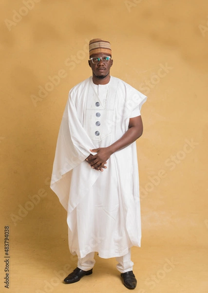 Obraz A Traditionally Dressed Northern Business Man Posing with Hands Clasped