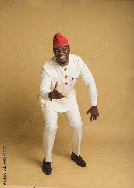 Obraz Yoruba Culturally Dressed Business Man Dancing and Smiling
