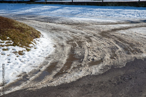 Fototapeta view of a snowy road in winter on a bright sunny day