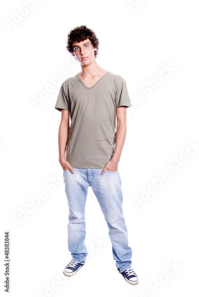 Obraz Young man standing with hands in pockets