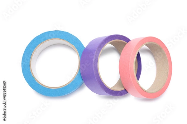 Fototapeta Different rolls of adhesive tape on white background, top view