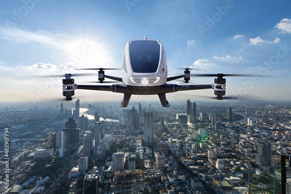 Fototapeta Autonomous driverless aerial vehicle flying on city background, Future transportation with 5G technology concept