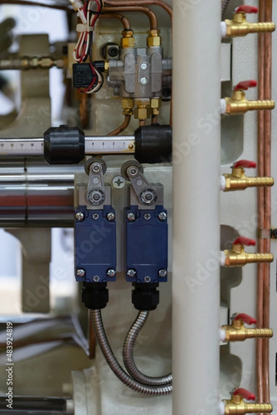 Fototapeta Limit switch use as distance detector installed in factory line. Limit swith use as safety switch for industry.