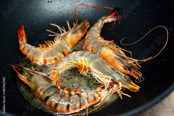 Fototapeta Large raw uncooked prawns or langoustines in shell.
