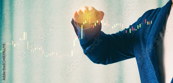 Fototapeta a successful investor, trader, manipulates the direction of the price of stocks, securities, the concept of investment and management, a close-up of the trader's hands
