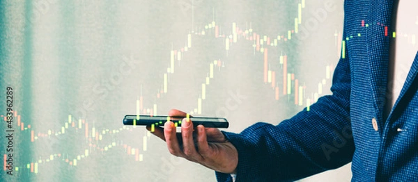 Fototapeta a successful investor, trader, manipulates the direction of the price of stocks, securities, the concept of investment and management, a close-up of the trader's hands