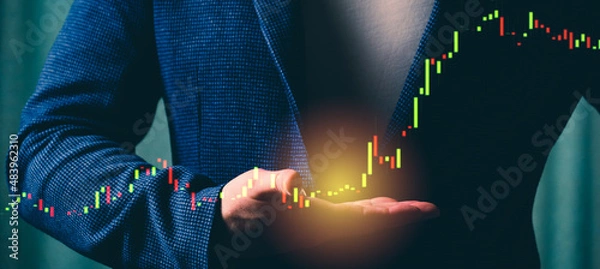Fototapeta a successful investor, trader, manipulates the direction of the price of stocks, securities, the concept of investment and management, a close-up of the trader's hands