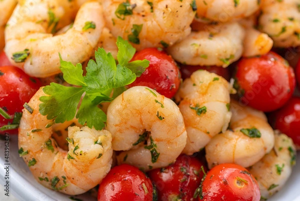 Fototapeta Fried shrimp with fresh vegetables. Shrimp salad with cherry tomatoes, garlic, fresh herbs and olive oil.