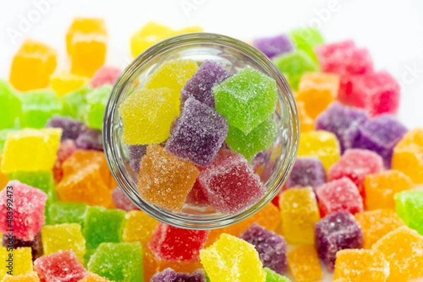 Fototapeta Cube jelly candy in container and the floor. Circle glass contained sweetie candy.