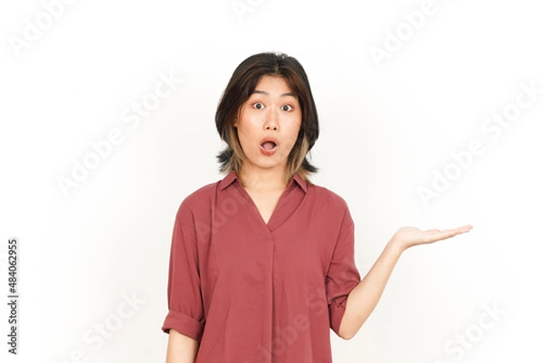 Fototapeta Showing and Holding Product on Open Palm Of Beautiful Asian Woman Isolated On White Background