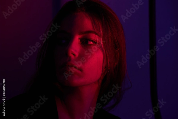 Obraz Half-lighted face of girl with blueish and very peri background