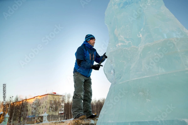 Fototapeta Portrait of a sculptor in a blue winter suit