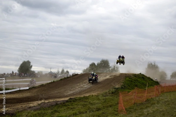 Obraz motocross bikers on motorcycles with carrycot