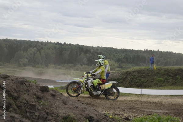 Obraz motocross bikers on motorcycles with carrycot