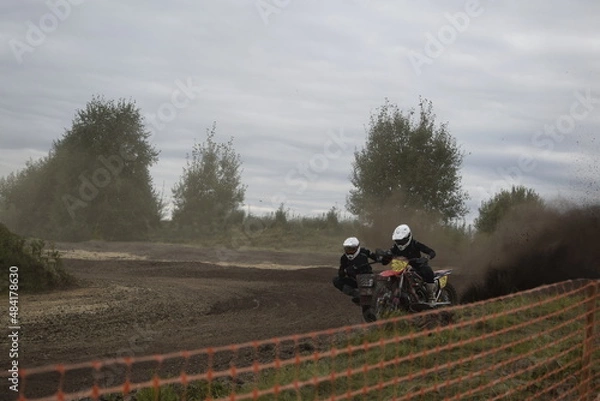 Obraz motocross bikers on motorcycles with carrycot