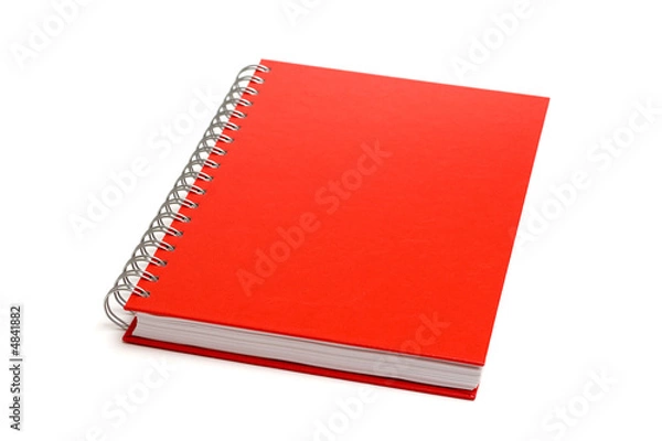 Fototapeta Red notebook isolated on white. Shallow DOF