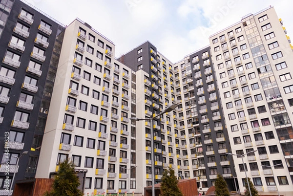 Fototapeta Facades of a new residential building. New multi-storey building in the housing complex of New Moscow.