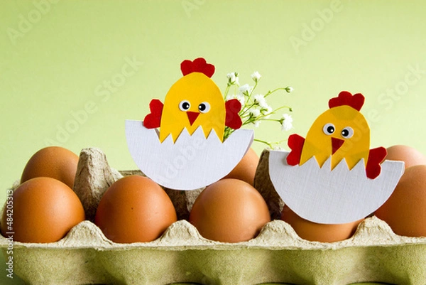 Fototapeta Easter. Easter decor. Handmade chicken in a basket with fresh chicken eggs. Preparation for an Easter card. Seasonal decor. copy space.