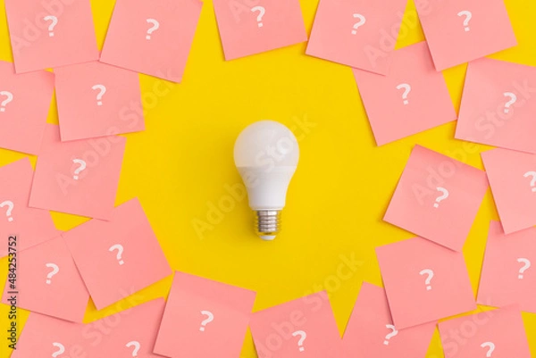 Fototapeta Light bulb on yellow background. Inspiration and creative idea concept.