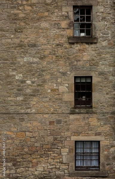 Fototapeta Three Windows on Stone Wall