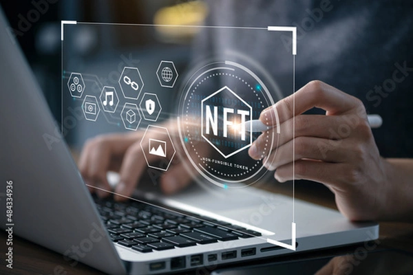 Fototapeta Businessman using a computer for NFT non fungible token for crypto art blockchain technology concept.