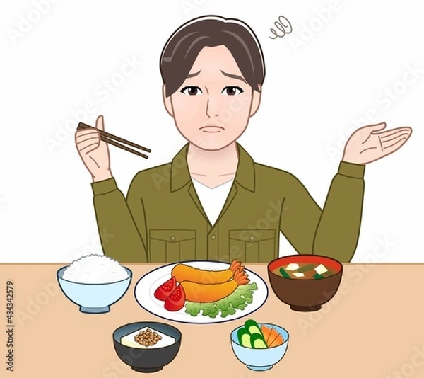 Fototapeta 食事をしている若い男性