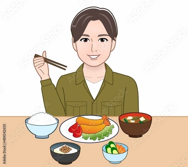 Fototapeta 食事をしている若い男性