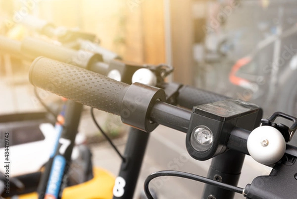 Obraz Steering wheel of rolling electric scooters close-up.