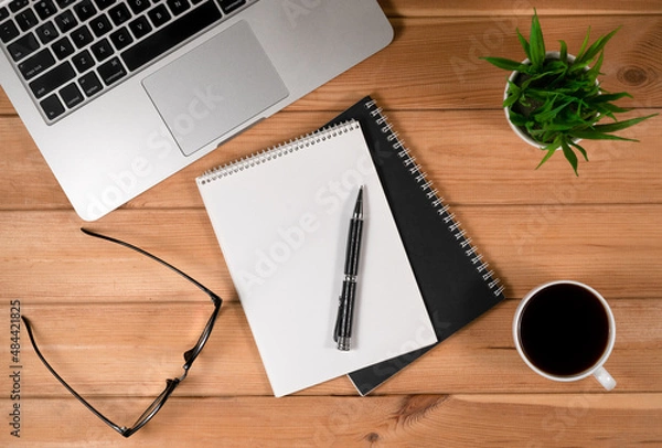 Obraz Laptop, Notebook and Office Supply Items on Wooden Work Desk