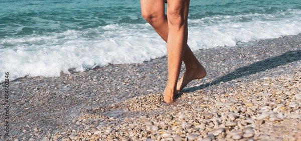 Obraz Women's legs along the seashore