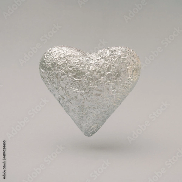 Fototapeta Crumpled arge silver heart made of aluminum foil. Minimal concept of Valentine's Day with a gray background