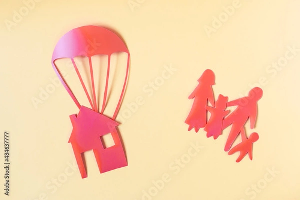 Fototapeta The concept of solving the housing problem. A minimalistic painting depicting a family and a house with a parachute.