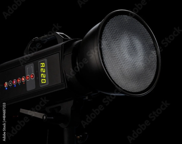 Fototapeta Studio flash on black background