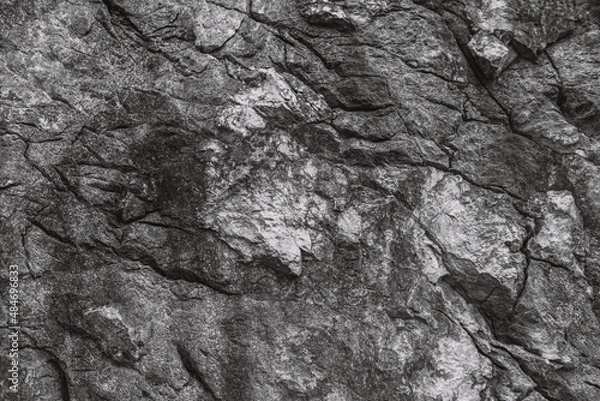 Obraz Horizontal black and white colors photography of real stony textured surface of mountain. Abstract flat lay texture of stones