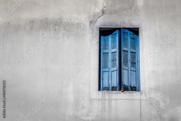 Fototapeta European street. Wooden shutters. Facade of a residential building. Travel in Europe. Open and closed shutters. French windows.