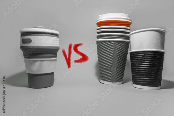 Fototapeta  Reusable coffee cup vs paper disposable coffee cups. Conscious consumption. Caring for the environment. High quality photo